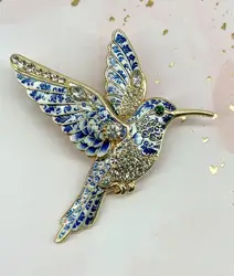broche en émail bleu motif colibri