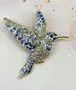 broche en émail bleu motif colibri