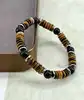 brpi bracelet élastique en pierre oeil de tigre, onyx et acier argenté d8 mm