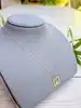 collier orné d'un pendentif carré orné d'un strass or 375 millième (9 ct) 0,98g