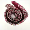cravate hermès 100% soie rouge à motifs pommes, fleurs et feuillage