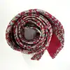 cravate hermès 100% soie rouge à motifs pommes, fleurs et feuillage