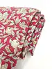 cravate hermès 100% soie rouge à motifs pommes, fleurs et feuillage