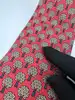 cravate hermès vintage en soie rouge à motif arbres