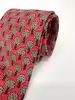 cravate hermès vintage en soie rouge à motif arbres