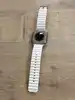 montre connectée apple watch ultra + cellular, boîtier titane 49mm avec bracelet océan blanc