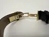 montre tissot t063610a, mouvement quartz, cadran noir, boîtier doré et bracelet en cuir noir