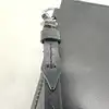 pochette montblanc en cuir lisse noir et bleu avec dragonne amovible