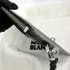 pochette montblanc en cuir lisse noir et bleu avec dragonne amovible