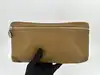 pochette / trousse longchamp en cuir grainé camel avec détails métalliques argentés