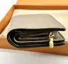 portefeuille compact louis vuitton cléa en cuir mogogram de couleur tourelle
