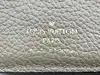 portefeuille compact louis vuitton cléa en cuir mogogram de couleur tourelle