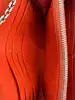 portefeuille sur chaîne dior addict rendez-vous en cuir rose et orange