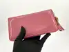portefeuille zippé gucci en cuir verni rose avec pendentif bambou