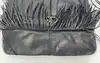 sac tote à fringes gérard darel flower en cuir noir à bandoulière