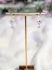 boucles d'oreilles pendentes chacune ornée d'un motif coeur vidé et un oxyde rond or 750 millième (18 ct) 0,74g