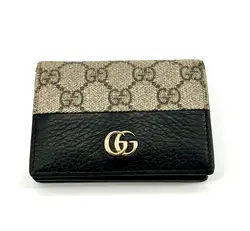 portefeuille gucci bicolore gg marmont en cuir noir et toile beige