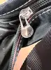 sac lancel porté épaule en toile noir et cuir marron