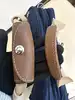 sacoche porte-documents/sac de voyage lancel bleu marine en toile et cuir avec cadenas et clés